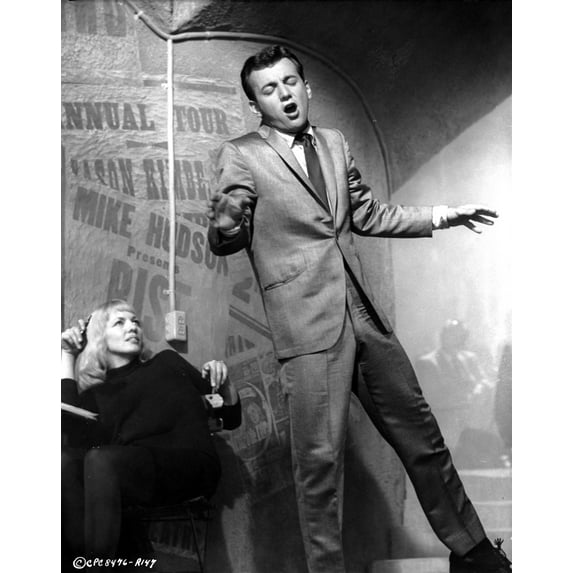 Bobby Darin singing with a woman looking on Photo Print (24 x 30)