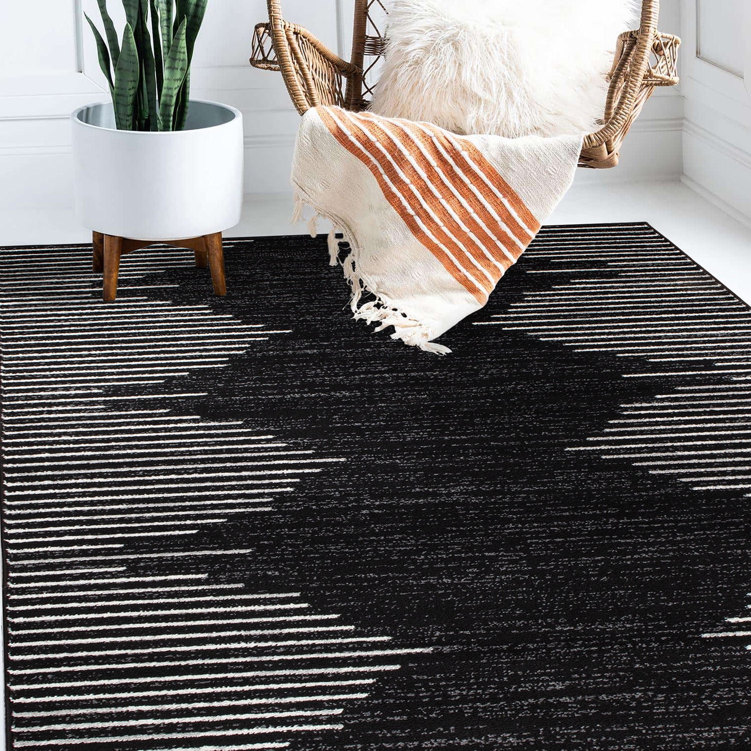 Black and White 5' x 7' Bohemian Stripe Synthetic Area Rug