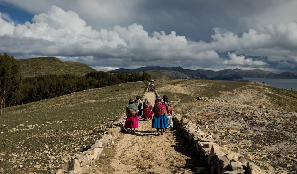 Bolivian women in traditional dress walking along the Inca Trail To Machu Picchu Isla Del Sol Lake Titicaca Bolivia Canvas Art - Panoramic Images (27 x 9)