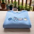 thumbnail image 1 of Book Candle Socks Snowflake Embroidered Sweatshirt, Cozy Winter Crewneck, Winter Reading Gift for Her, Bookish Xmas Hoodie, 1 of 4