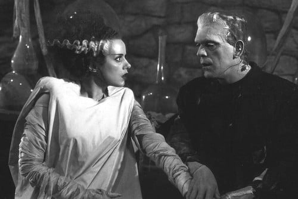 Boris Karloff and Elsa Lanchester in Bride of Frankenstein holding ...