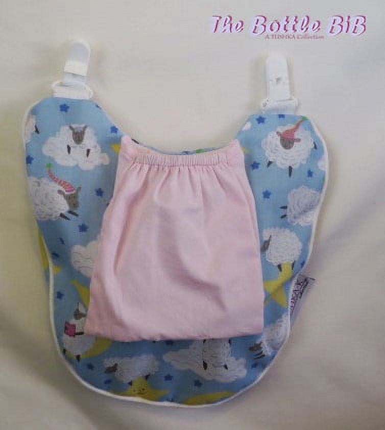 The Bottle Bib-Lullaby Collection Pink Keeps baby bottles, food pouches and training cups, from falling onto dirty surfaces!  Hands free Feeding! Check it out!