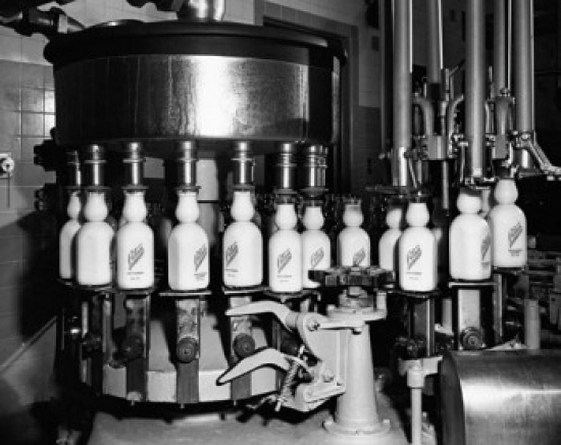 Bottles on a conveyor belt in a bottling plant Canvas Art -  (24 x 36)