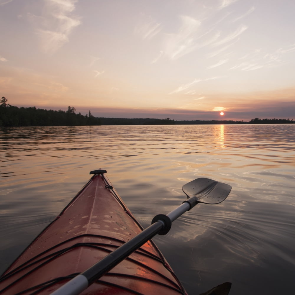 Bow of a red kayak and paddle on a tranquil lake at sunsetKeewatin ontario canada Canvas Art - Keith Levit Design Pics (24 x 24)