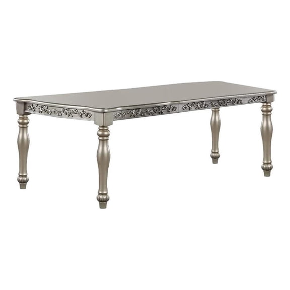 Bowery Hill 72 Inch Dining Table with Floral Carved Legs in Champagne