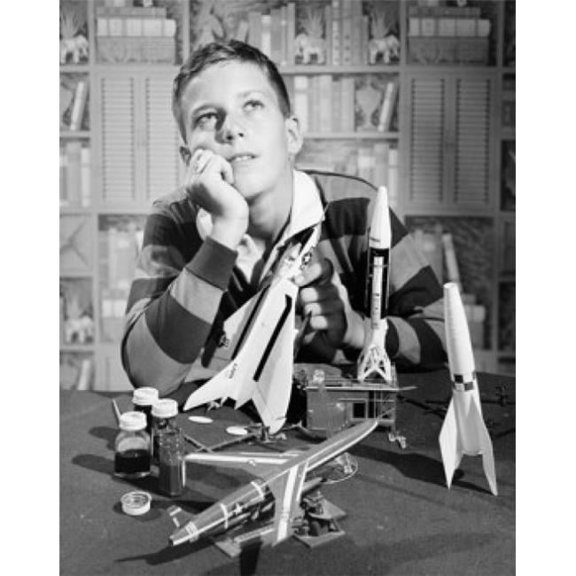Boy Holding Model Airplane & Looking Up Poster Print - 18 x 24 in.