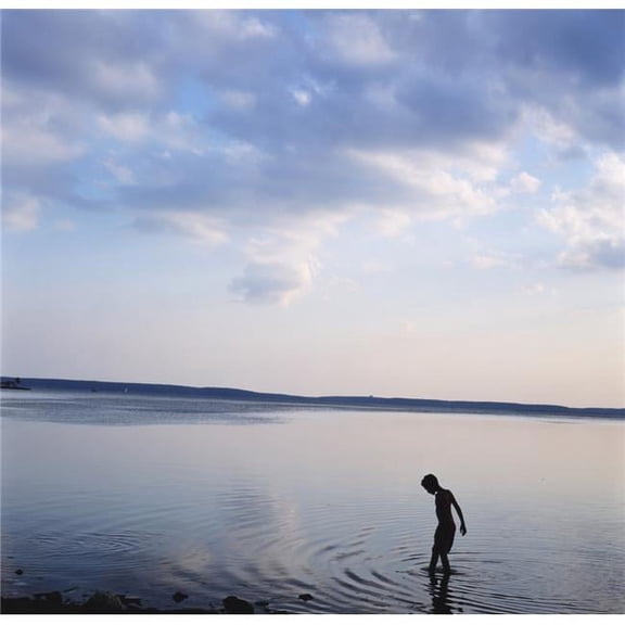 Boy In Silhouette Wading In Ocean Poster Print - 14 x 14