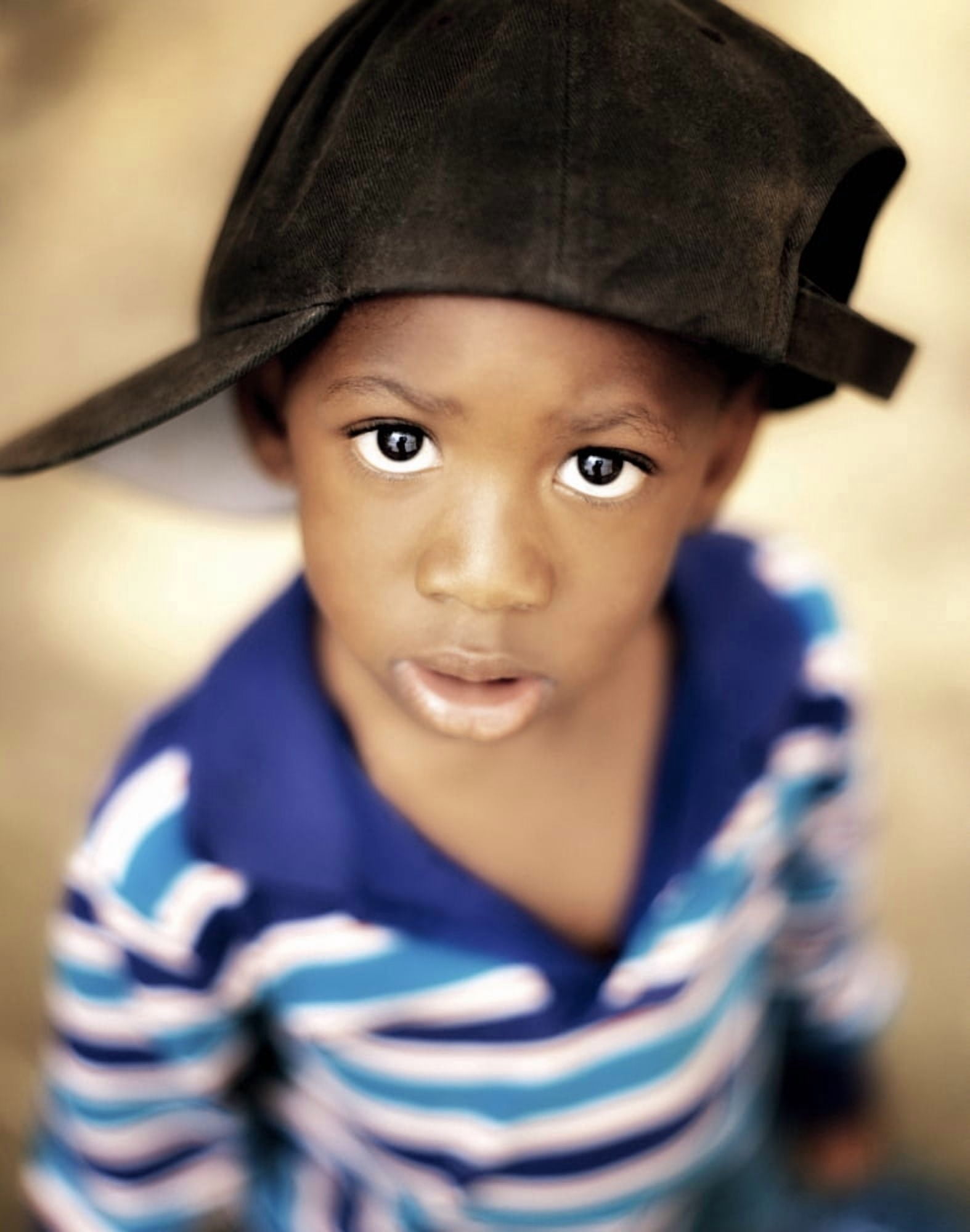 Boy Wearing Over Sized Hat Sideways Canvas Art - Ron Nickel Design Pics (26 x 34)