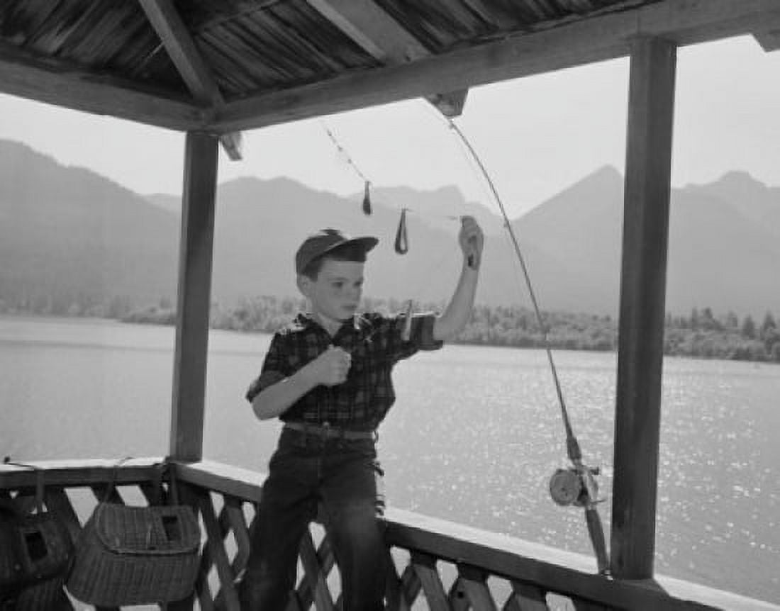 Boy adjusting fishing rod Canvas Art -  (18 x 24)