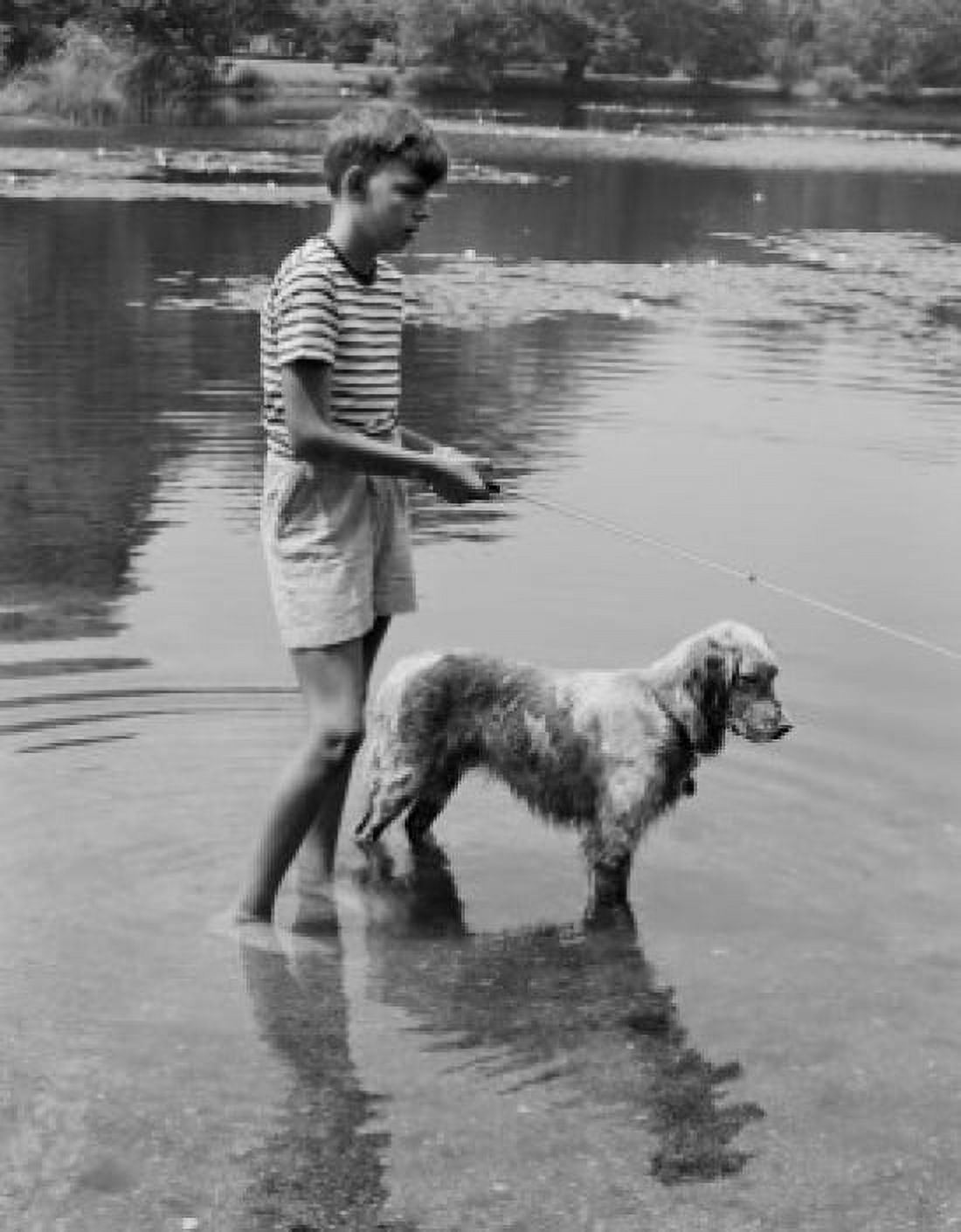 Boy and dog fishing in lake Canvas Art - (24 x 36)