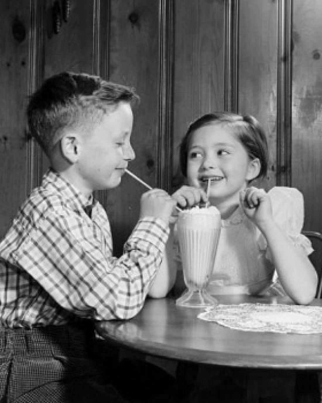 Boy and girl drinking milk shake Canvas Art - (24 x 36)