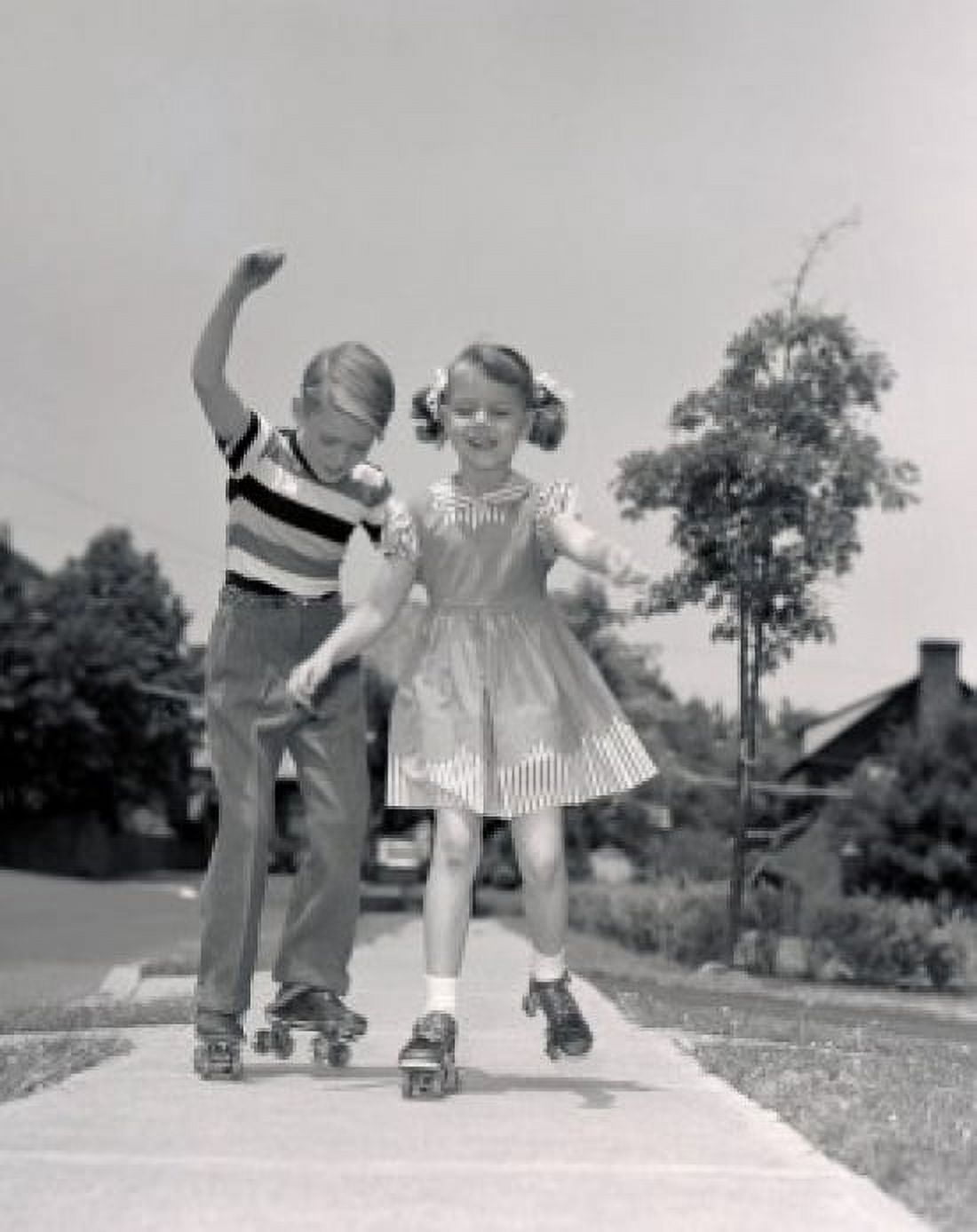 Boy and girl roller-skating Canvas Art - (18 x 24)