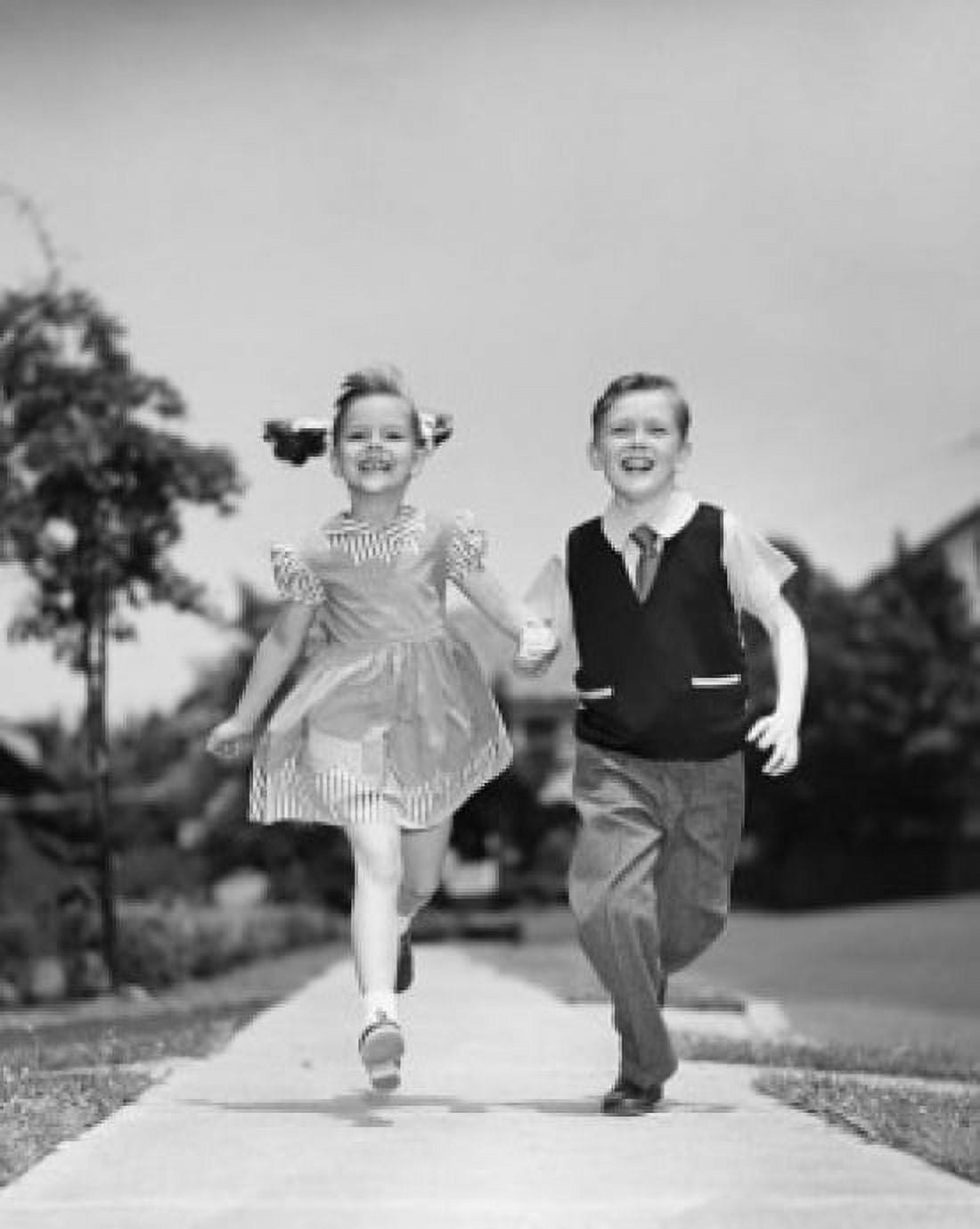 Boy and girl running on pavement Canvas Art - (24 x 36)