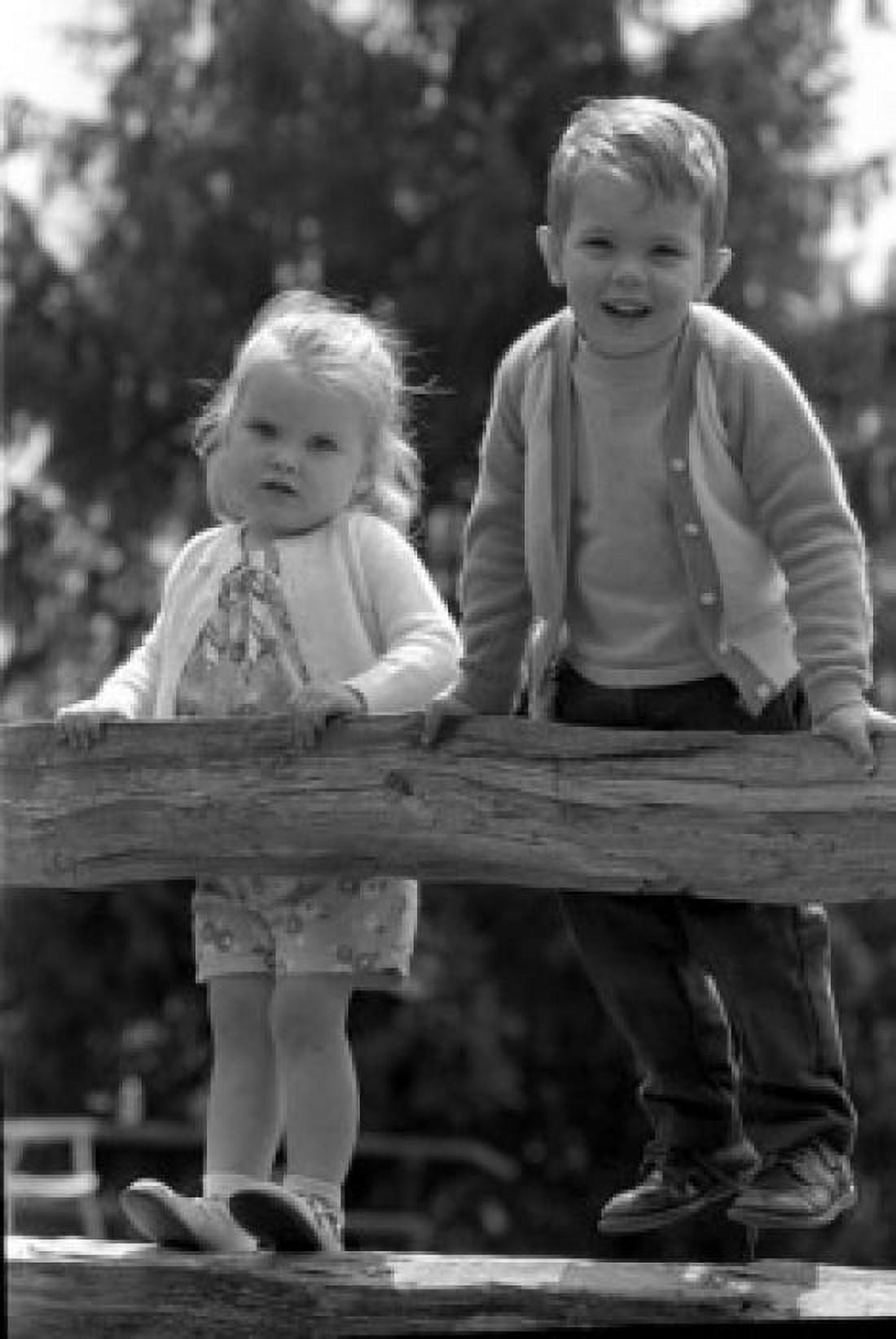 Boy and girl standing on rail fence Canvas Art - (18 x 24)