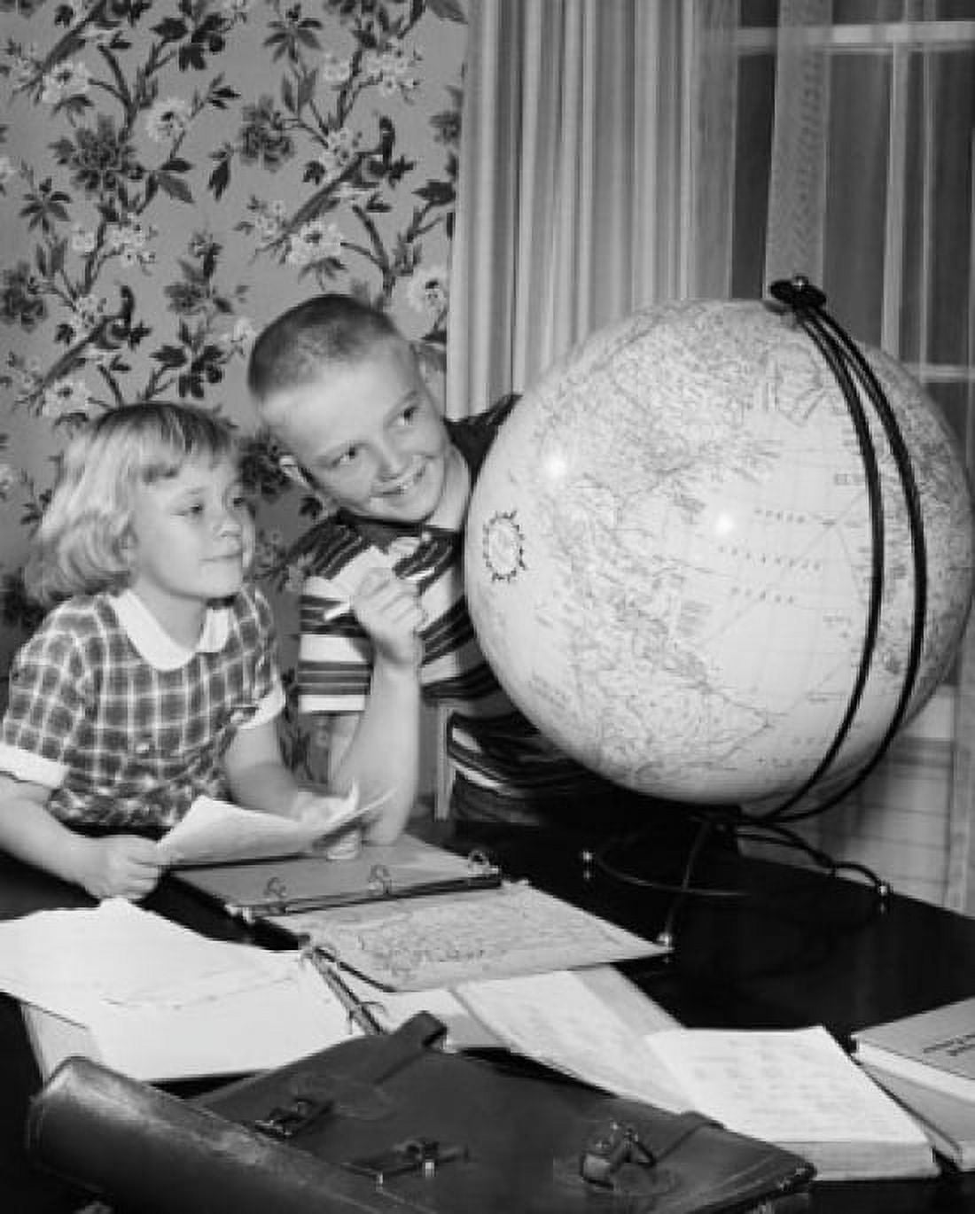 Boy and his sister looking at a globe Canvas Art - (18 x 24)