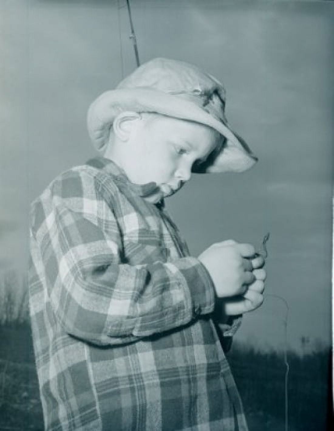 Boy baiting fishing hook Canvas Art - (18 x 24)