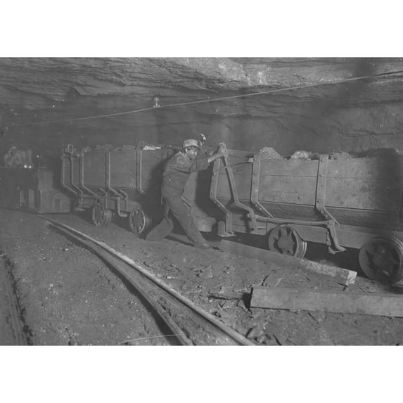 Boy braking on motor train 10 hrs. a day. Poster Print (24 x 36)