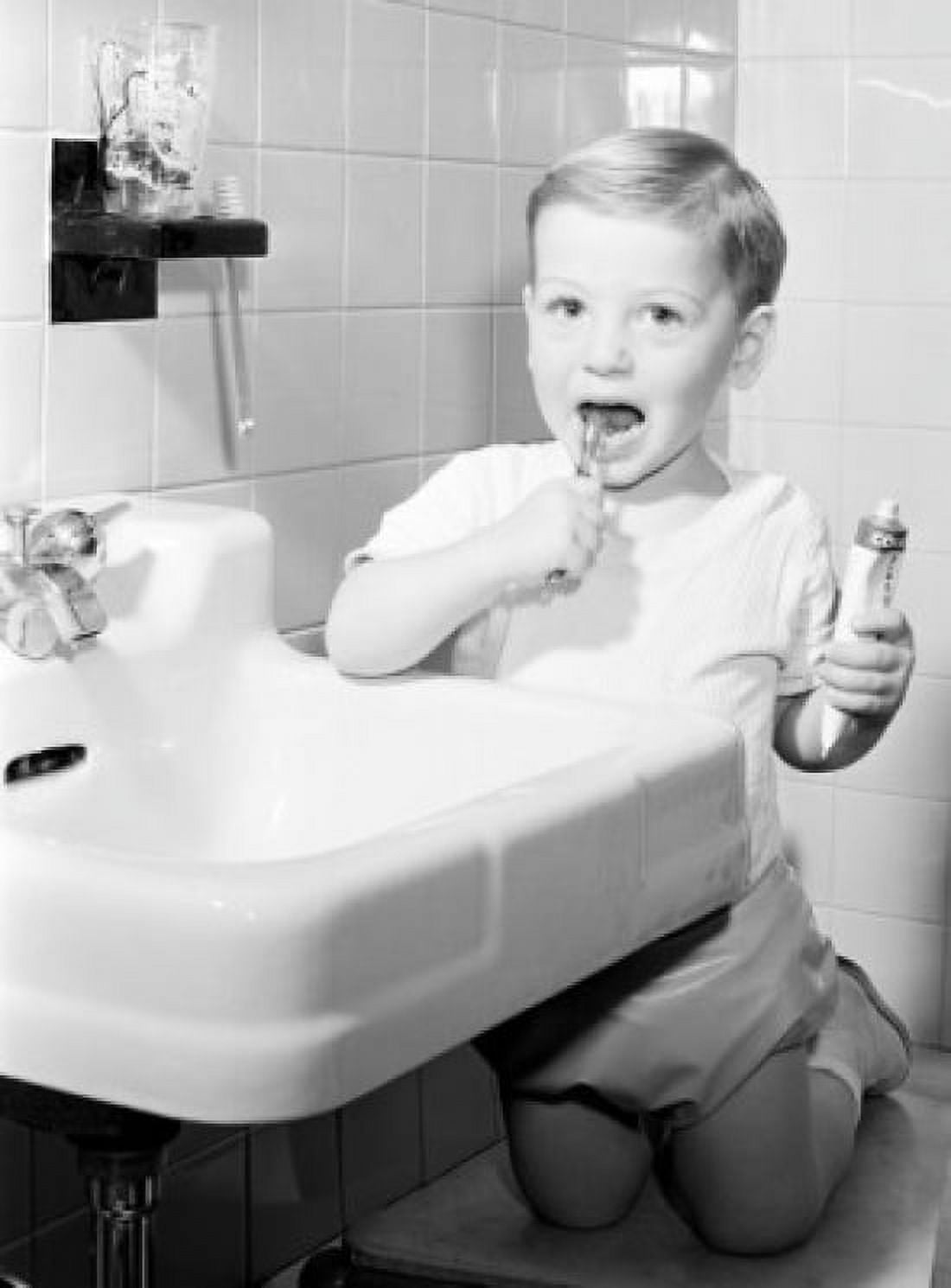 Boy brushing teeth in bathroom Canvas Art - (18 x 24)