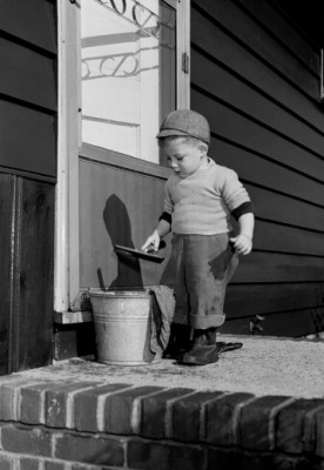 Boy cleaning window Canvas Art - (18 x 24)