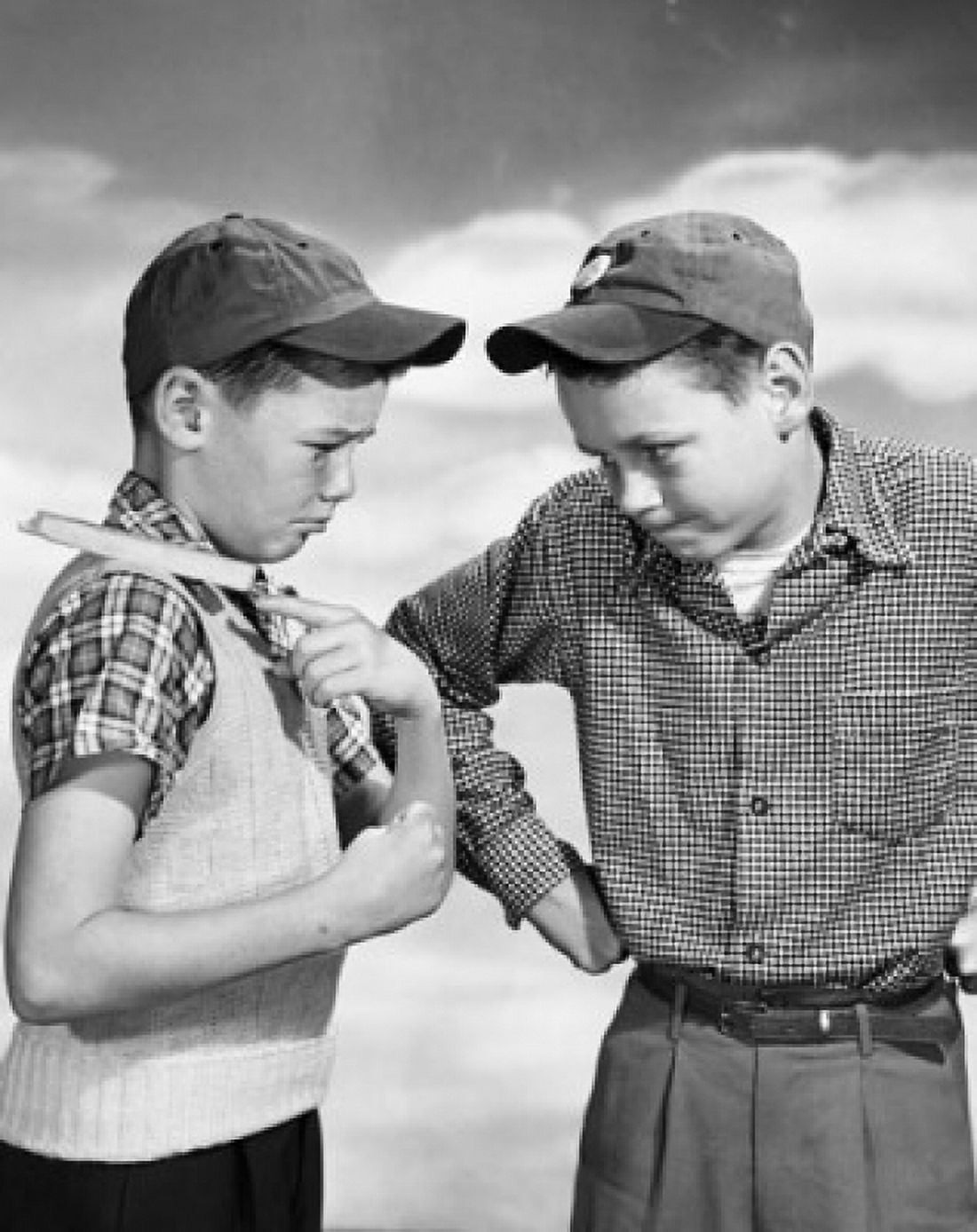Boy daring another to knock a chip off his shoulder Canvas Art - (18 x 24)