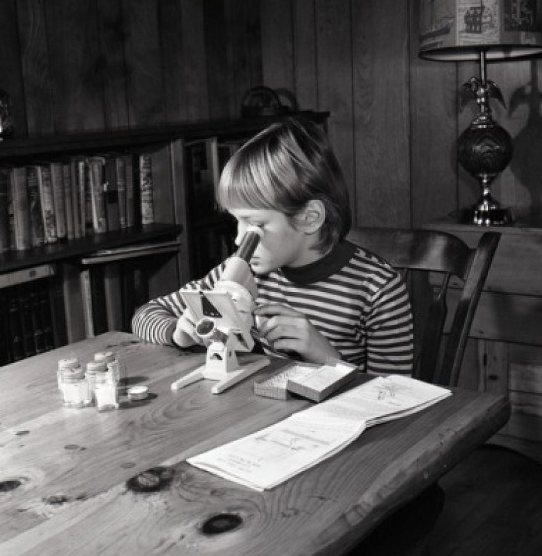 Boy doing homework Canvas Art - (24 x 36)