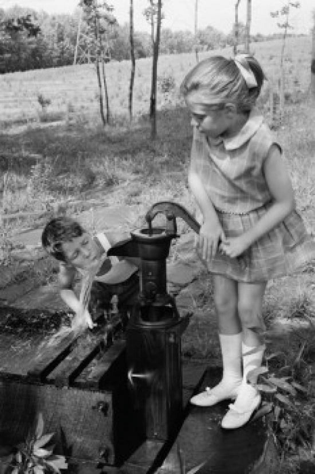 Boy drinking water as girl is drinking Canvas Art - (24 x 36)