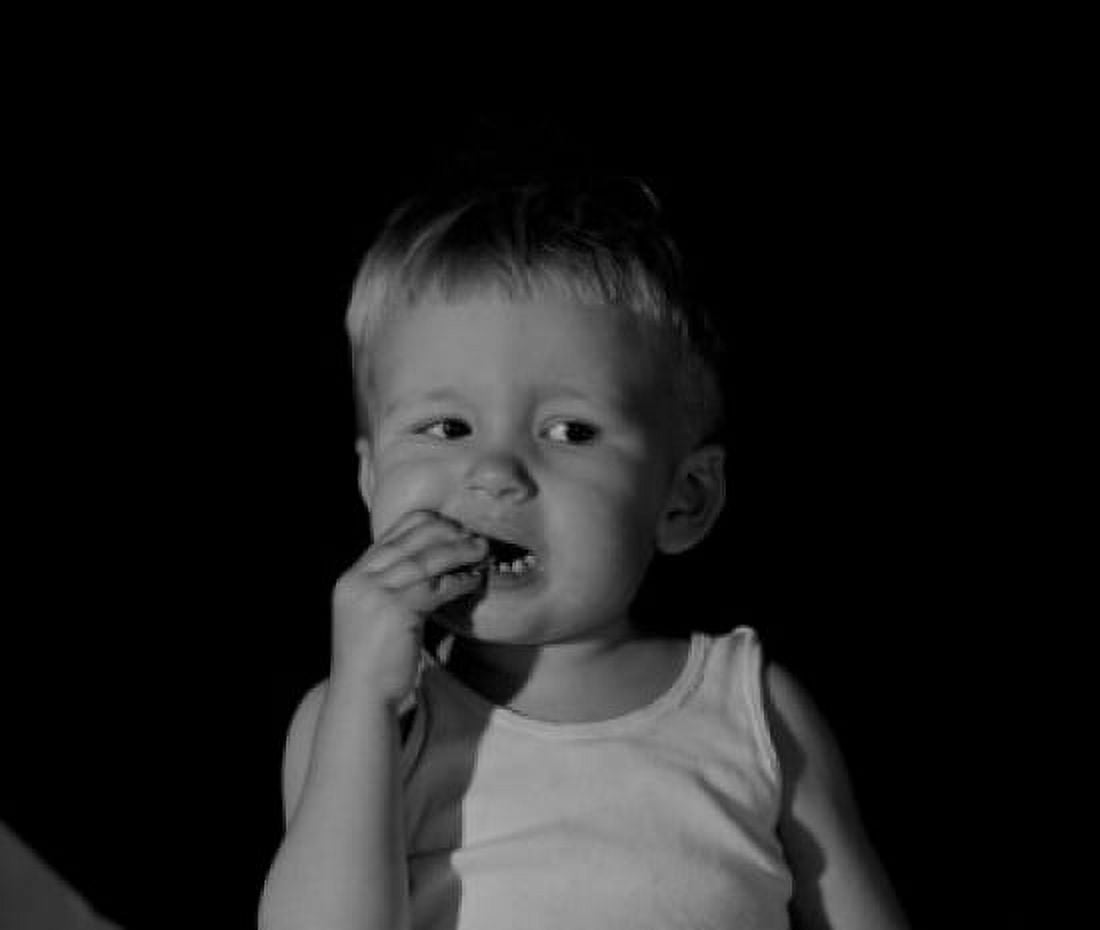 Boy eating biscuit Canvas Art - (18 x 24)