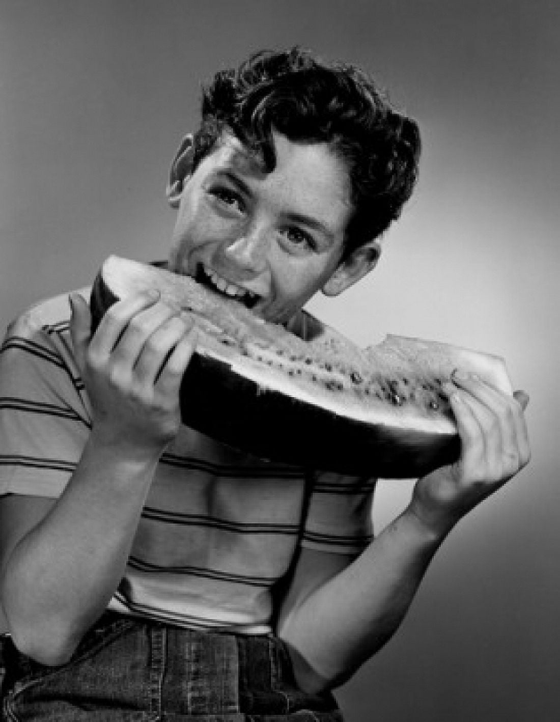 Boy eating large portion of water melon Canvas Art - (24 x 36)