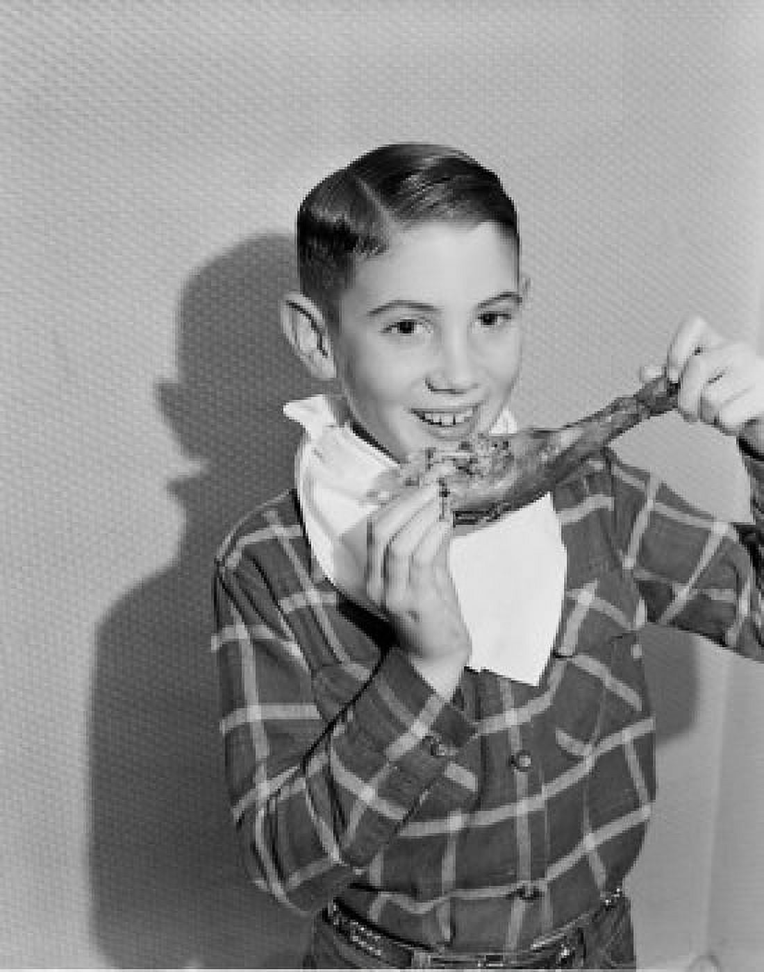Boy eating turkey leg Canvas Art - (24 x 36)