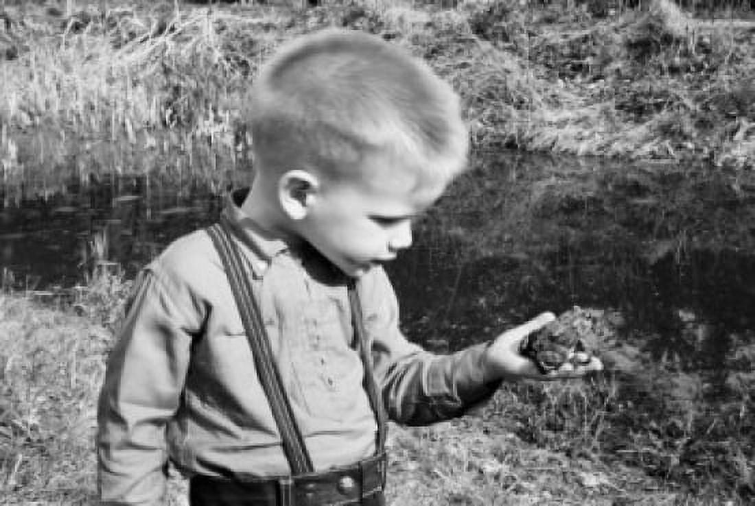 Boy examining frog Canvas Art -  (24 x 36)