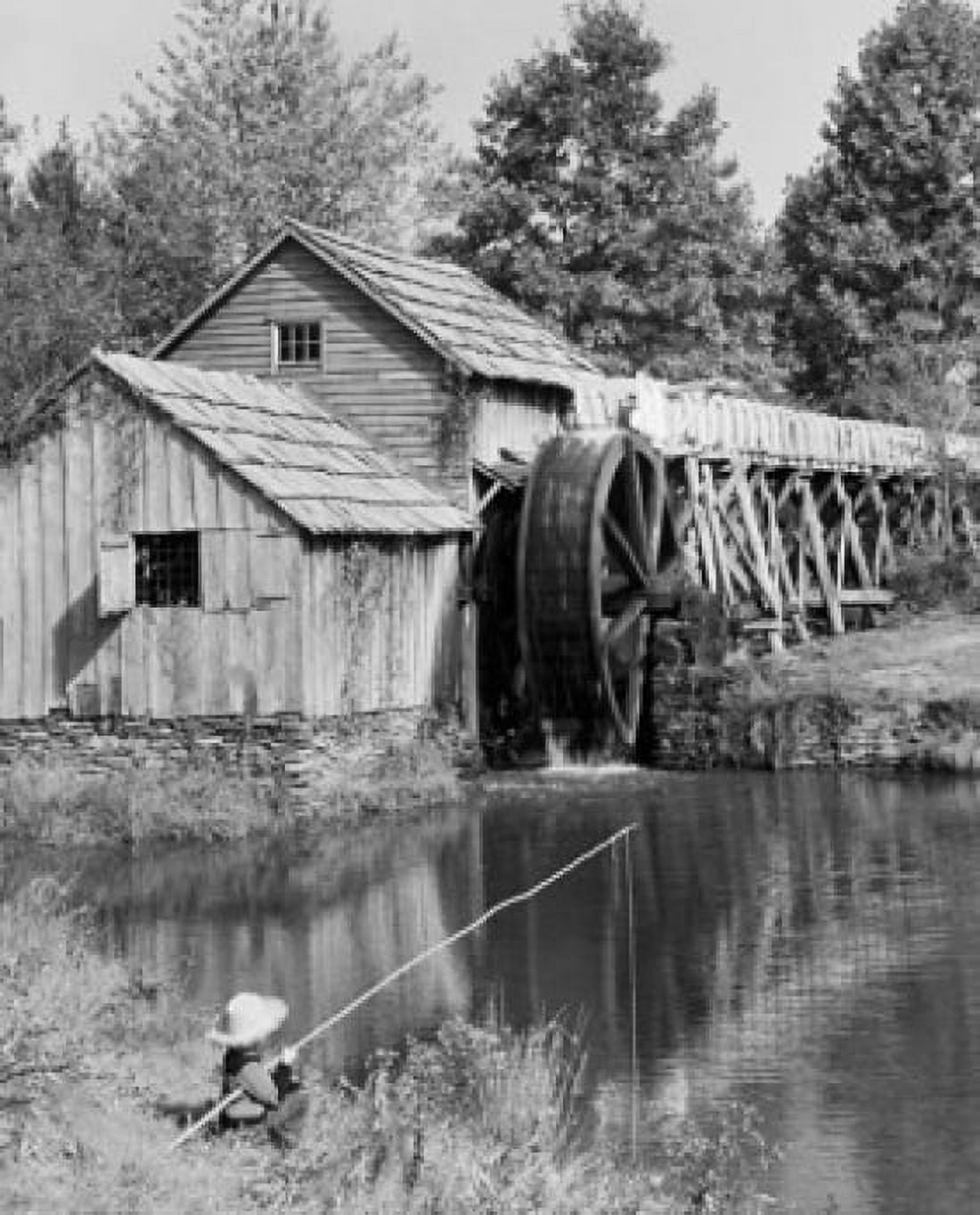 Boy fishing in a pond near a mill Mabry Mill Blue Ridge Parkway Virginia USA Canvas Art - (24 x 36)