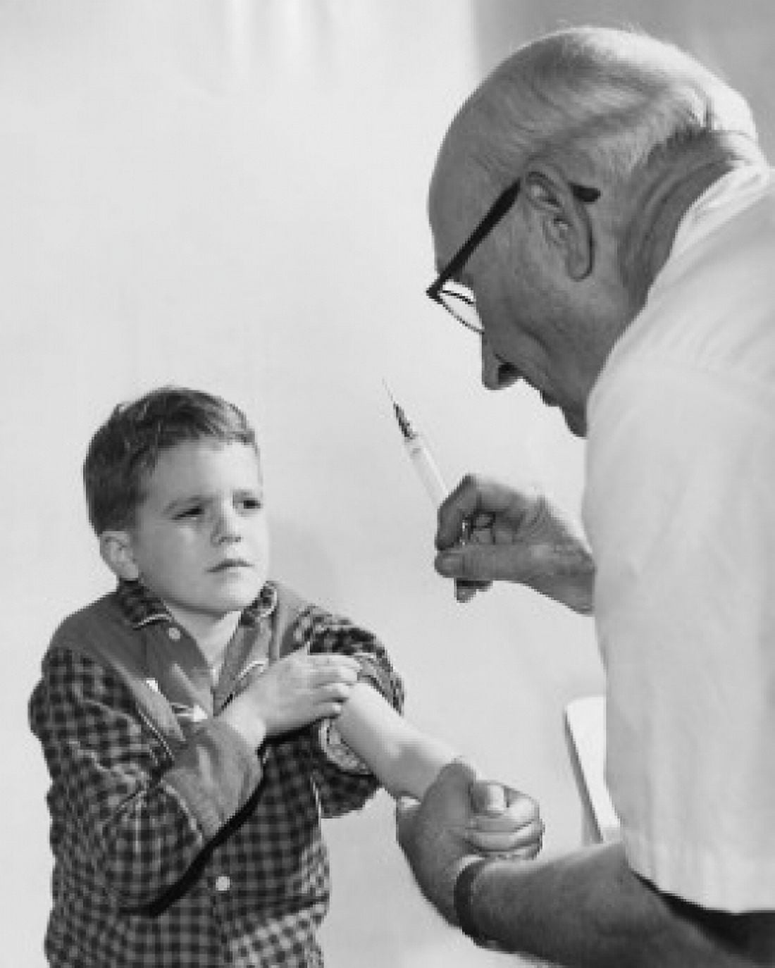 Boy getting an injection from a male doctor Canvas Art - (18 x 24)
