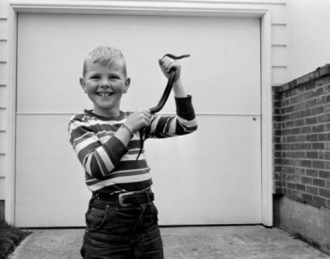 Boy holding Garter Snake Canvas Art - (18 x 24)