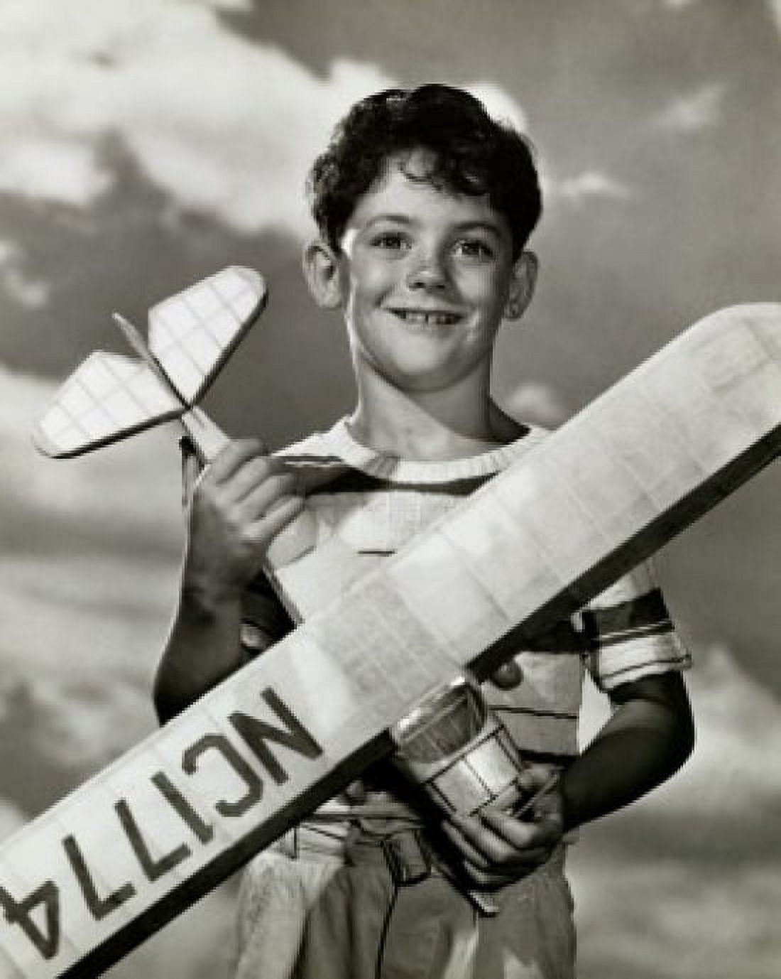 Boy holding a model airplane Canvas Art - (18 x 24)