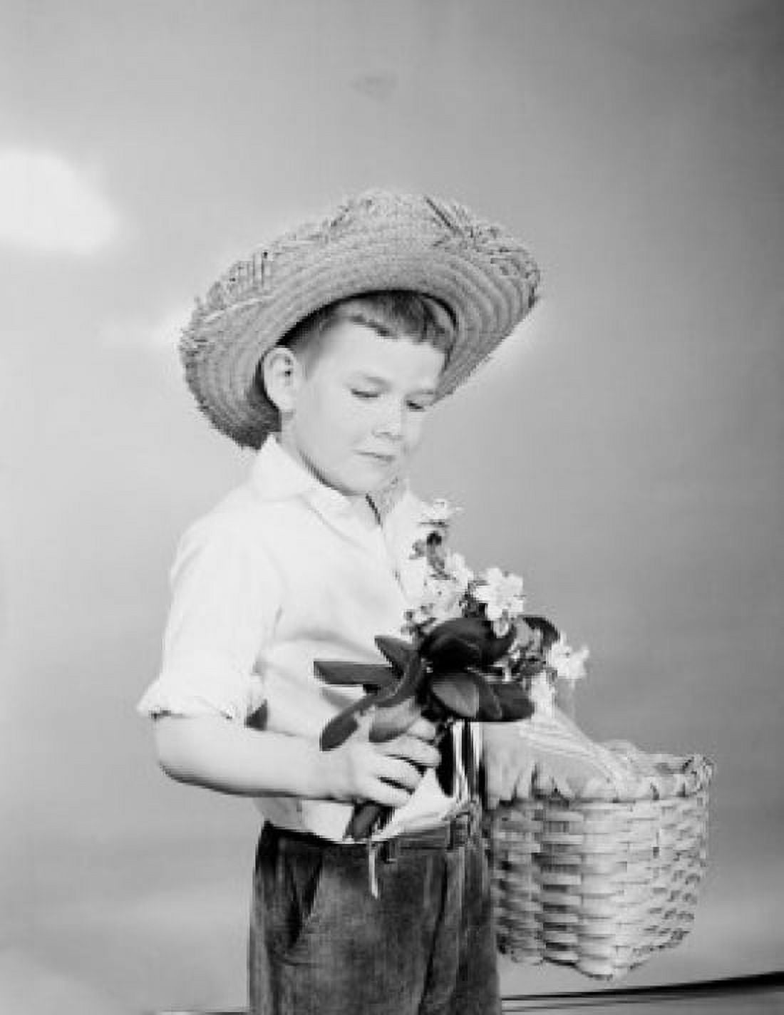 Boy holding bunch of flowers in one hand and basket in another Canvas Art - (24 x 36)