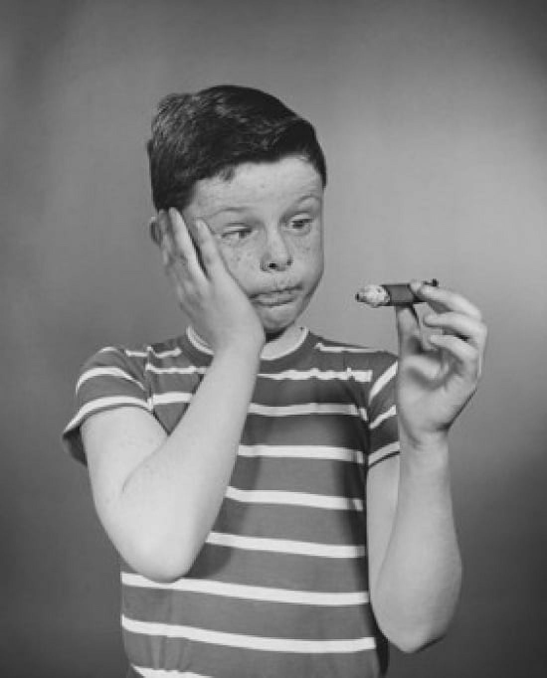 Boy holding cigar Canvas Art - (18 x 24)