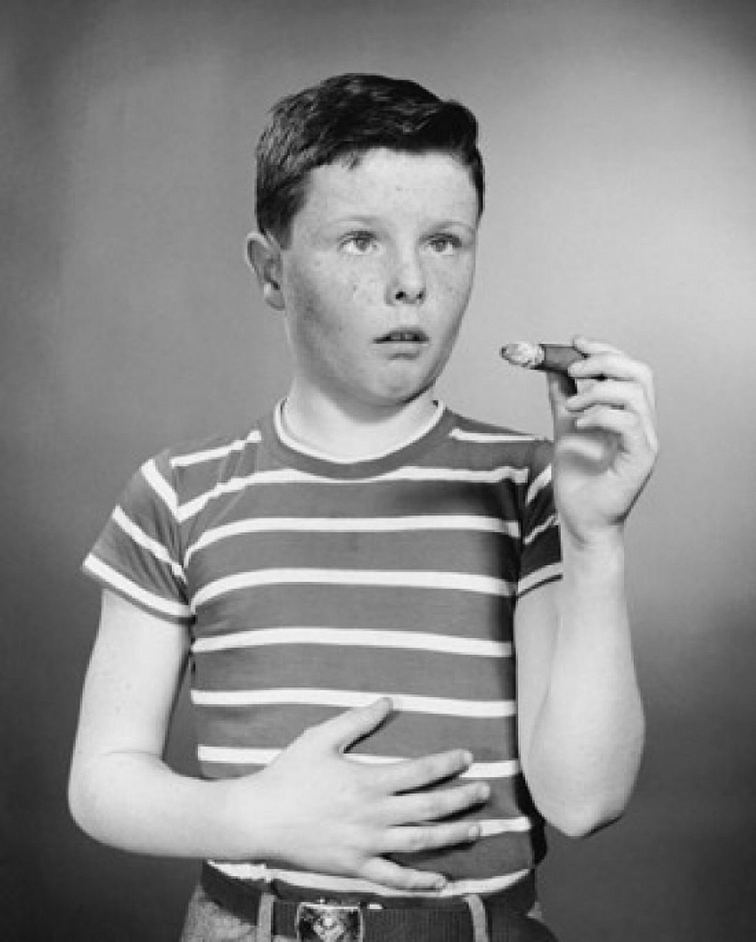 Boy holding cigar Canvas Art - (18 x 24)