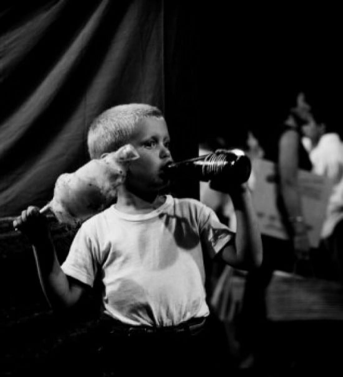 Boy holding cotton candy and drinking Canvas Art -  (24 x 36)