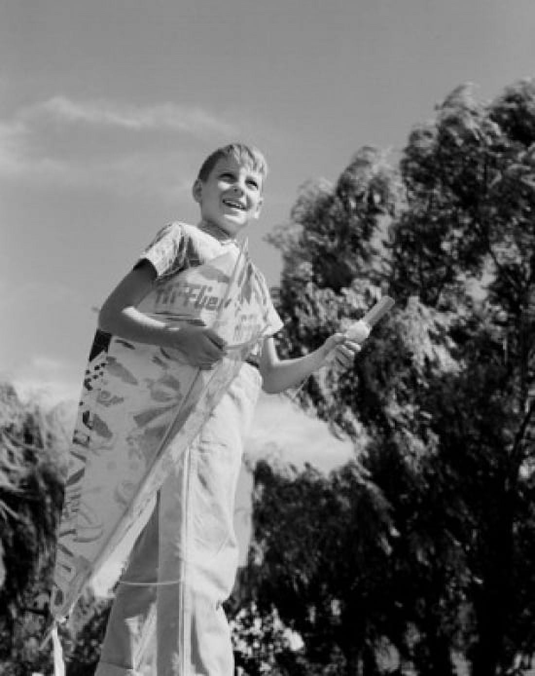 Boy holding kite Canvas Art - (18 x 24)