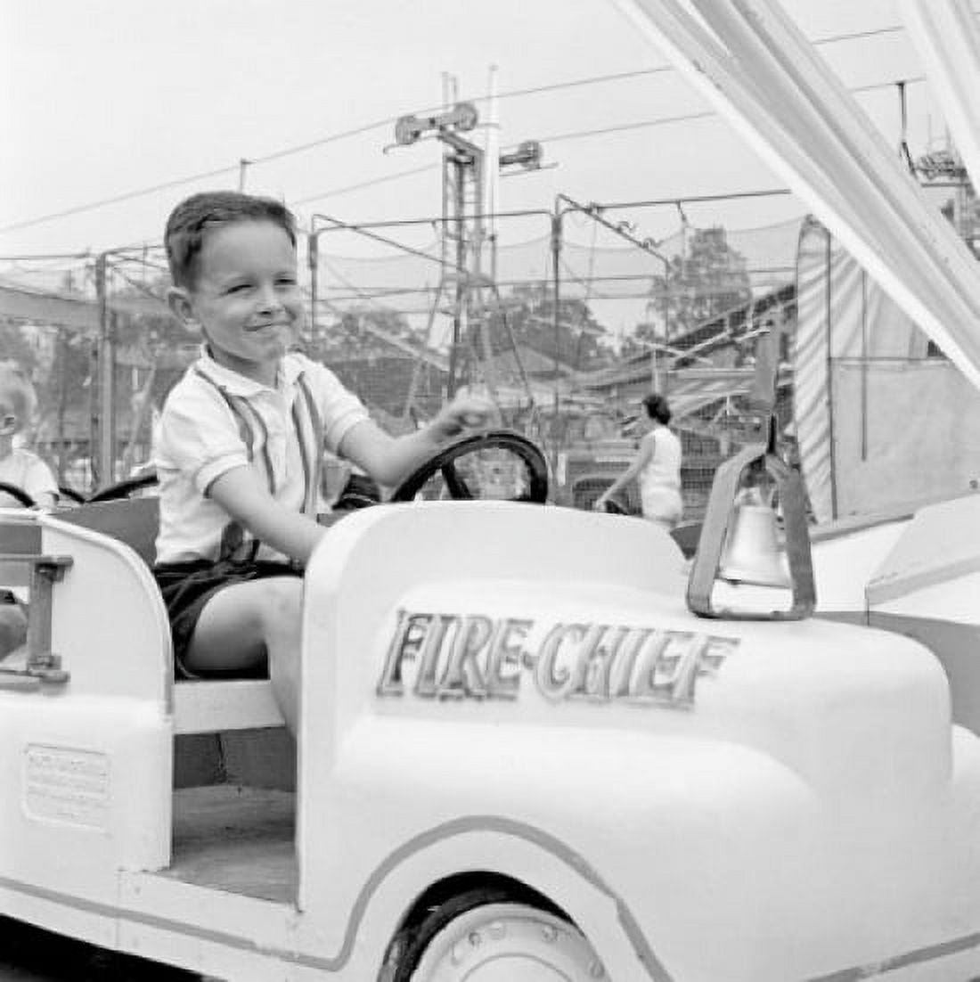 Boy in amusement park Canvas Art - (18 x 24)