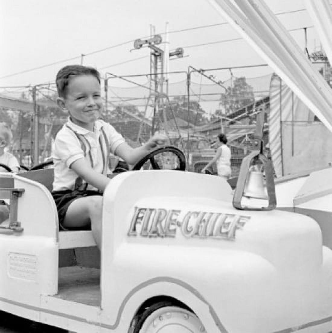 Boy in amusement park Canvas Art - (24 x 36)