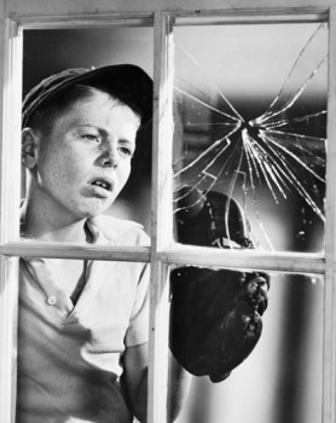 Boy looking at a broken window pane Canvas Art - (18 x 24)