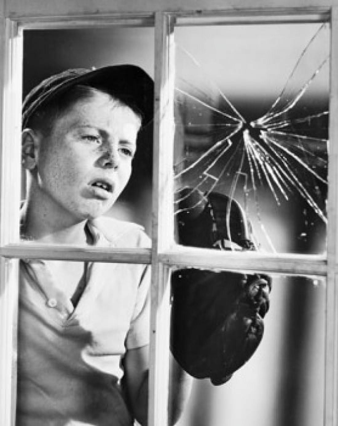 Boy looking at a broken window pane Canvas Art - (24 x 36)