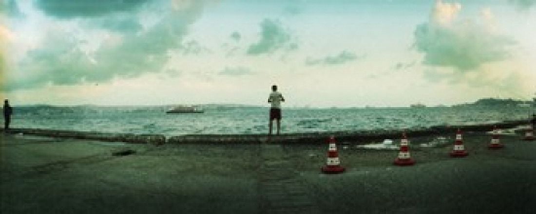 Boy looking out on the Bosphorus Strait Istanbul Turkey Canvas Art - Panoramic Images (30 x 12)