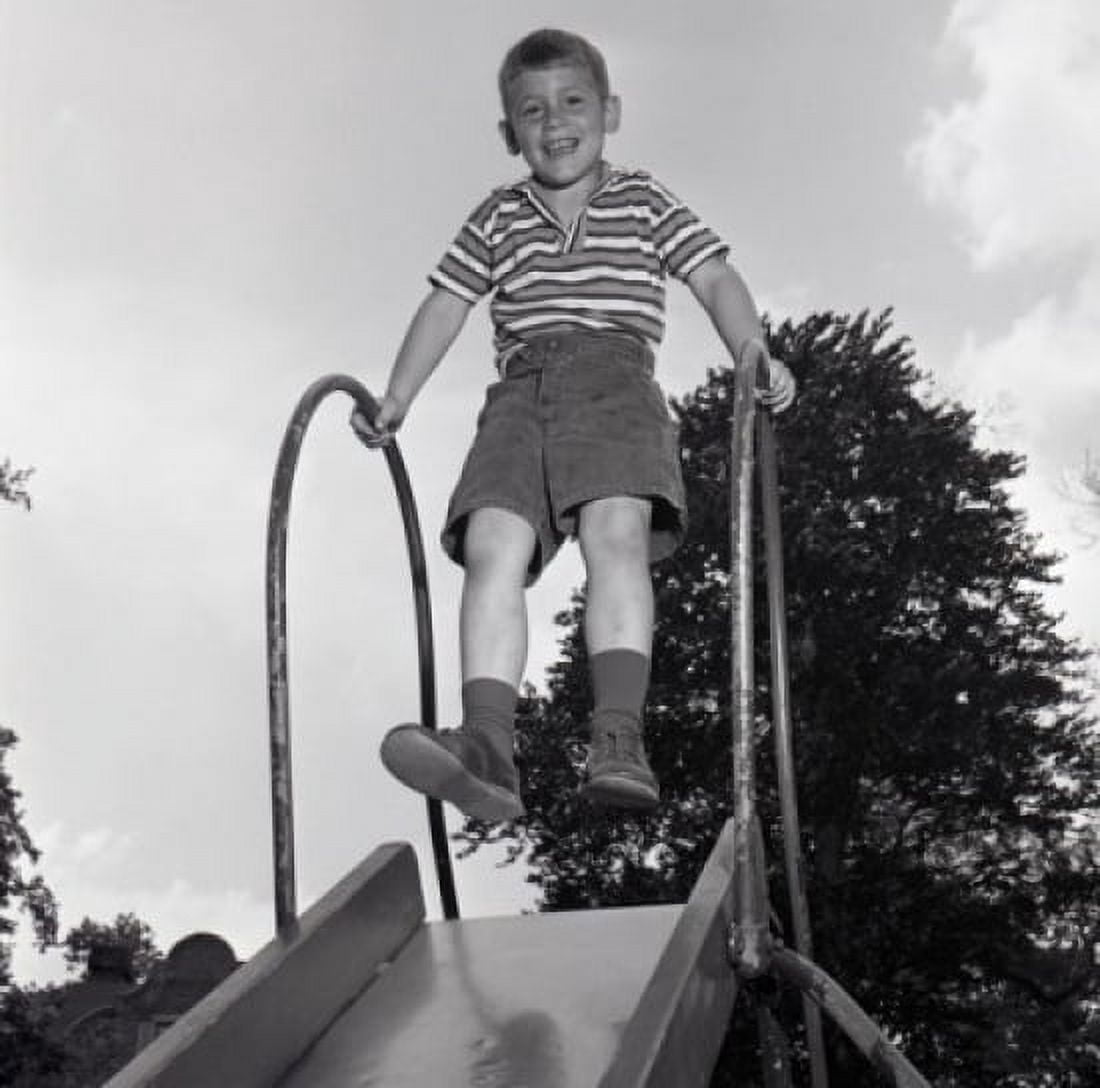 Boy on slide Canvas Art - (24 x 36)