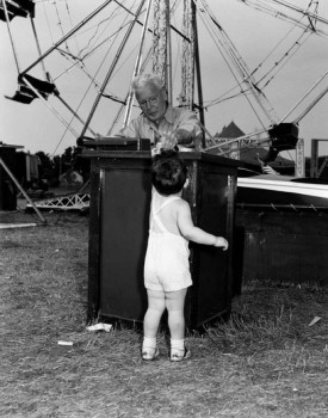 Boy paying for amusement park ride Canvas Art - (24 x 36)