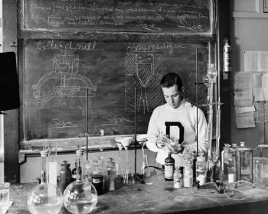 Boy performing an experiment in a chemistry laboratory Canvas Art - (24 x 36)