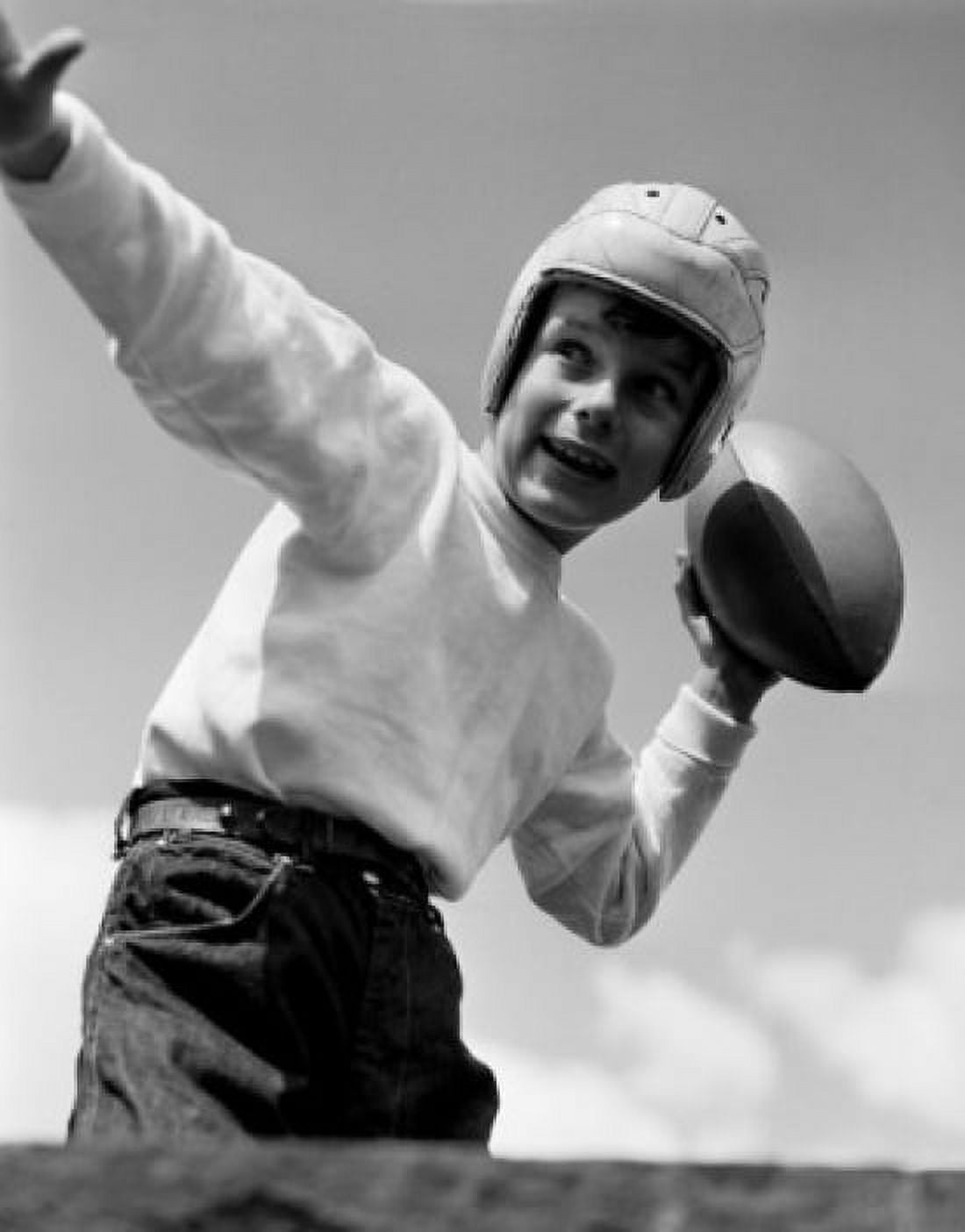 Boy playing American football Canvas Art - (18 x 24)