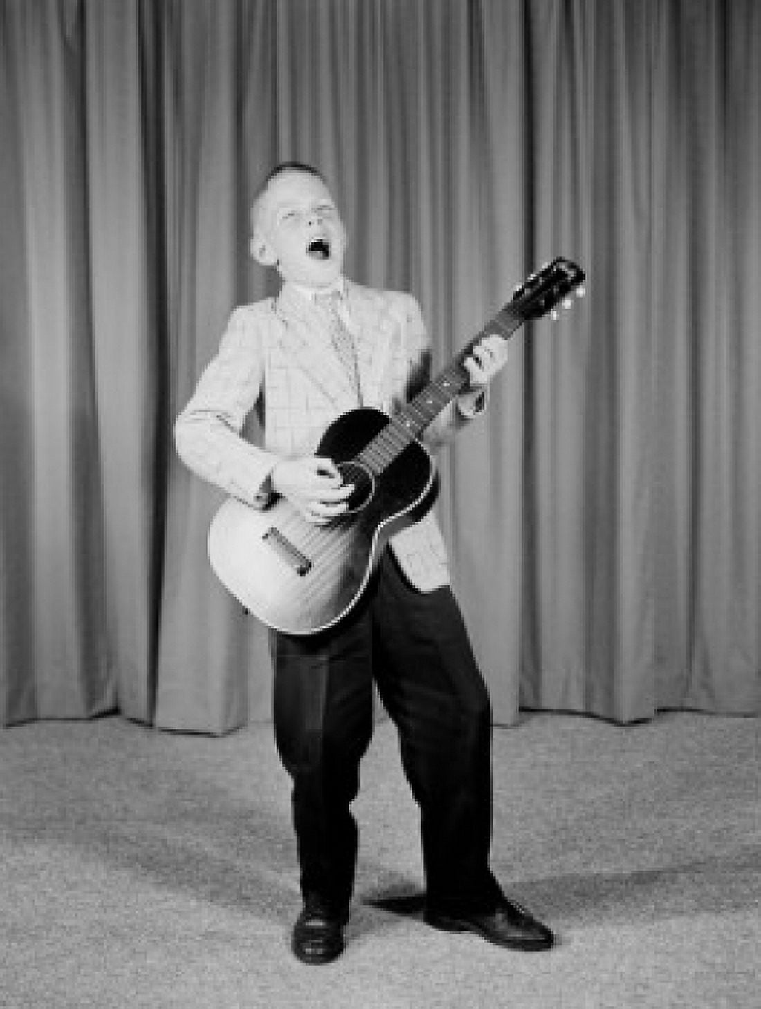 Boy playing guitar on stage Canvas Art -  (24 x 36)