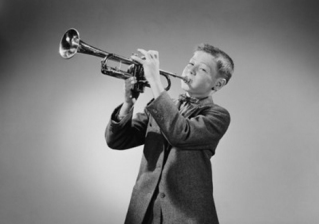 Boy playing trumpet studio shot Canvas Art - (18 x 24)